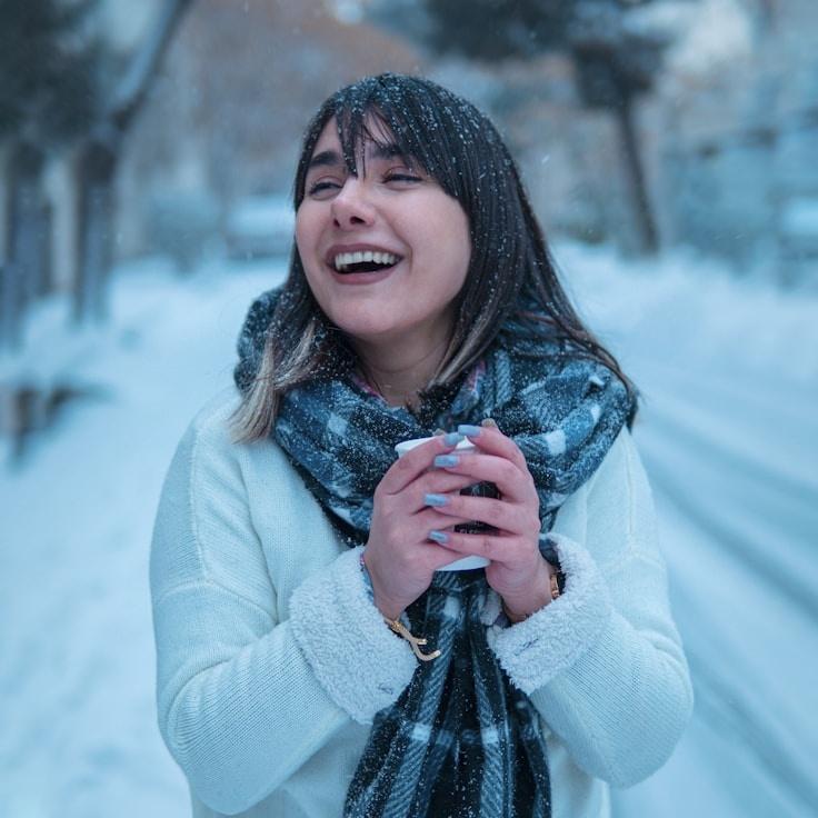 Mira Desai, Lead Design Curator at StudioHarborCore, reviewing corporate floral arrangements